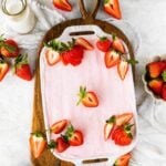 Best Strawberry Tiramisu Recipe (no egg). Final dish with strawberry powder for decoration and fresh cut strawberries on top.