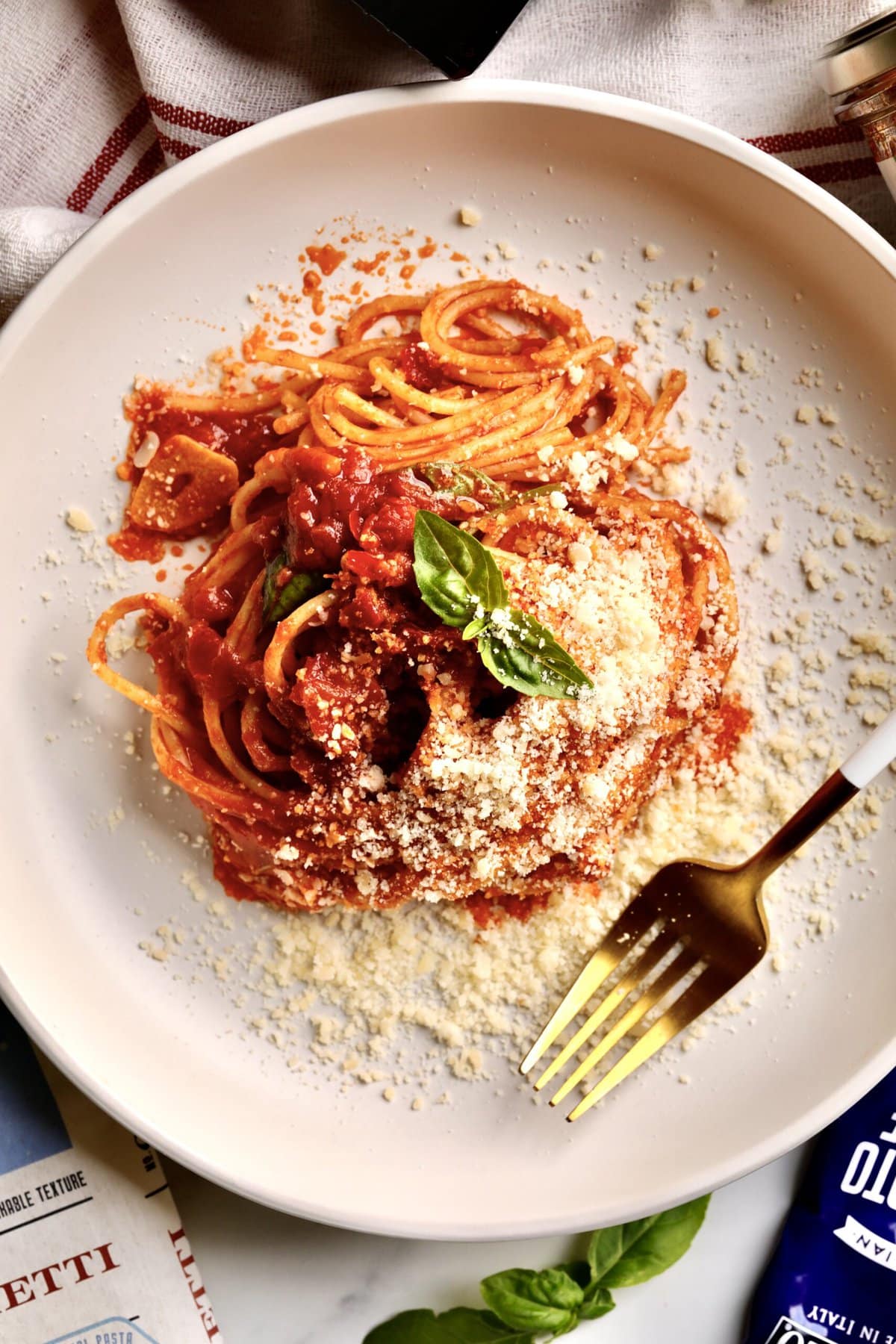 Quick Tomato Paste Pasta Sauce Recipe with Spaghetti on a plate with a fork.