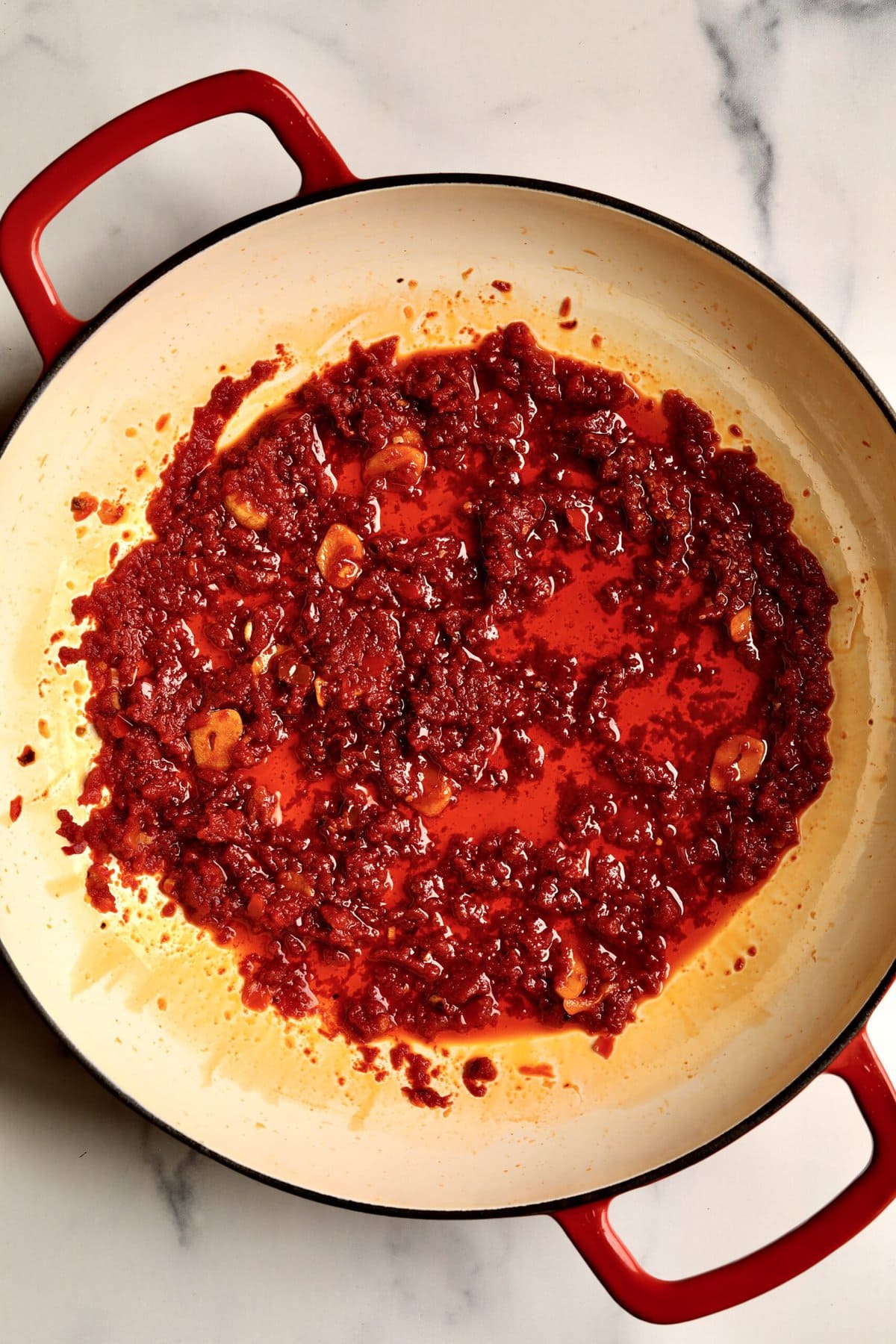 How to make: Quick Tomato Paste Pasta Sauce Recipe with Spaghetti- add the tomato paste to the pan and let it caramelize.