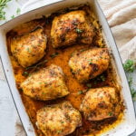 How Long to Bake Chicken Thighs at 375 (Best Recipe)- baked chicken in a pan with pan juices.