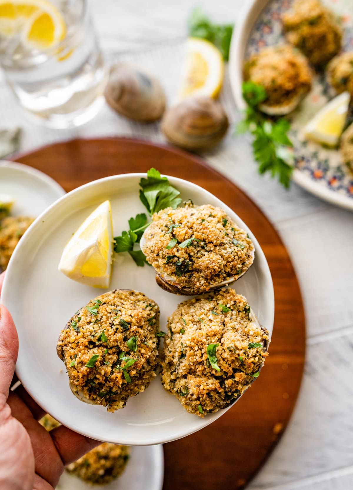 Best Italian Baked Stuffed Clams on a small plate ready to eat as an appetizer.