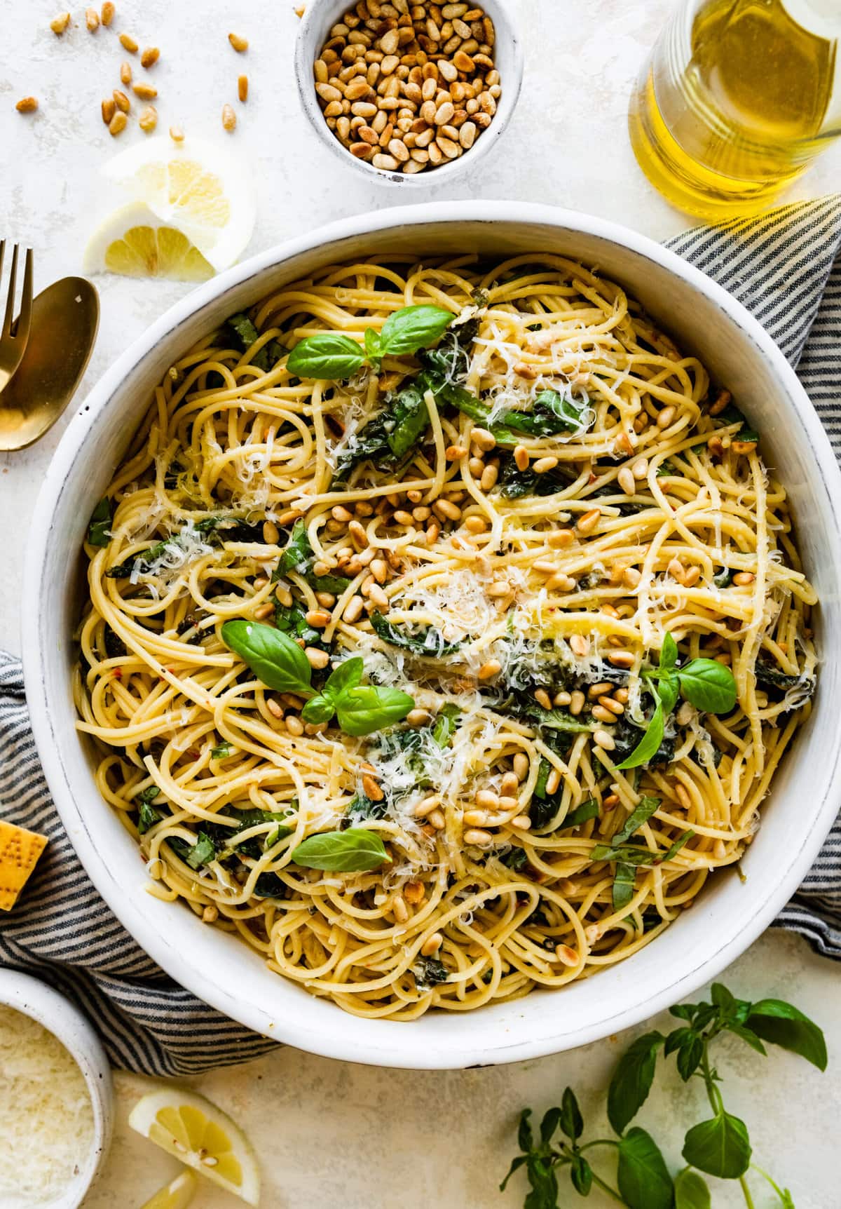 Easy Pasta with Sautéed Spinach and Garlic in a serving bowl with extra cheese on top and ready to serve.