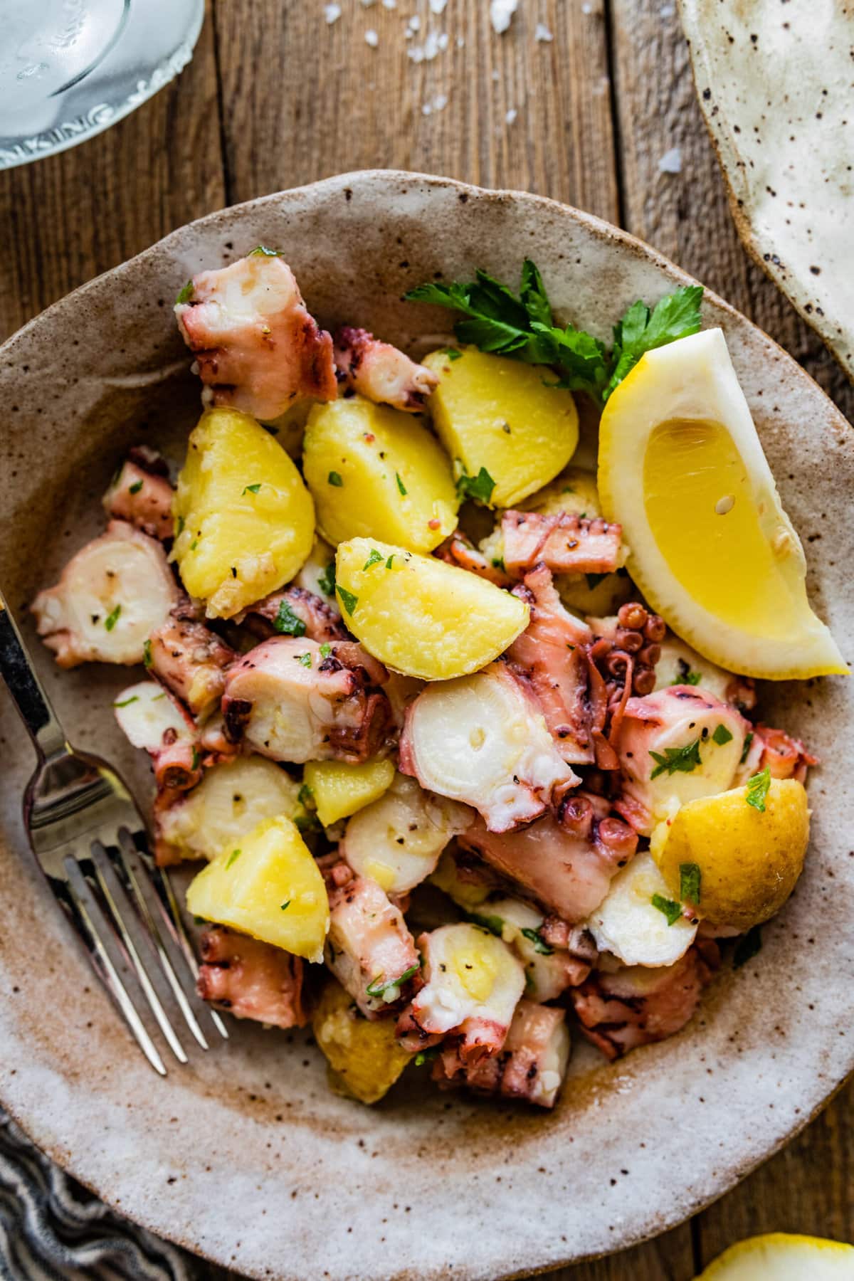 Italian Octopus Salad Recipe with Potatoes (Insalata Di Polpo) in a plate with a fork.