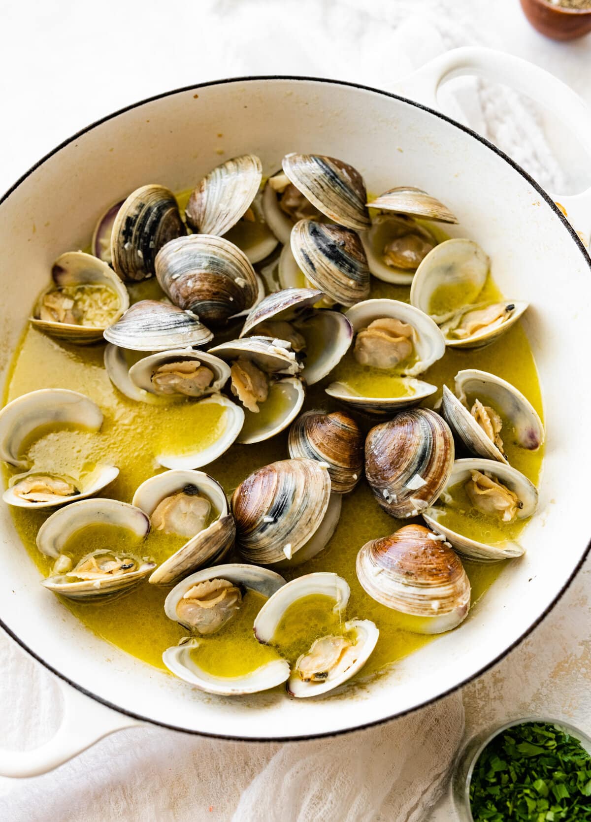 How to make- Spaghetti alle Vongole Recipe (Pasta with Clams)- clams cooking in the pan with olive oil.