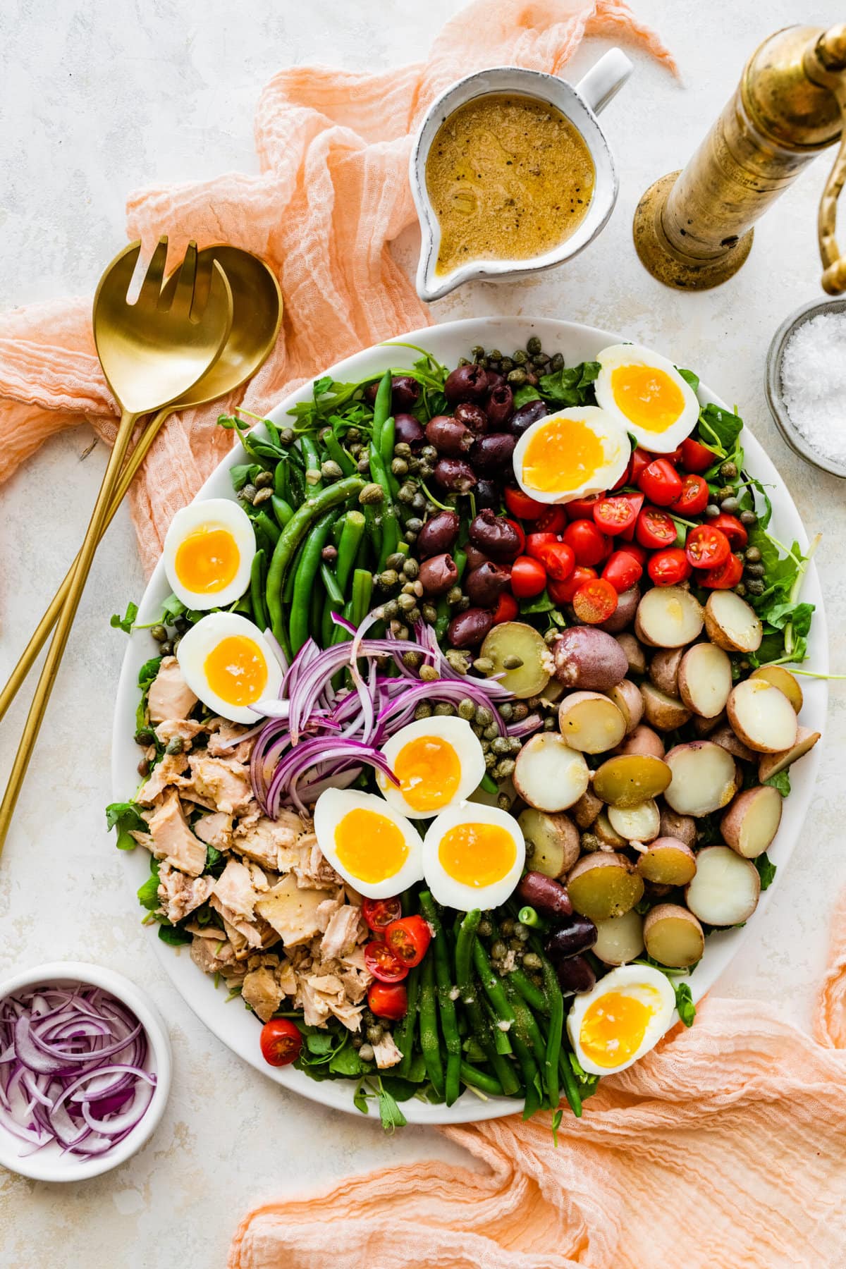 Tuna Nicoise Salad Recipe with Easy Vinaigrette- making the vinaigrette. Adding all ingredients to a large serving platter.