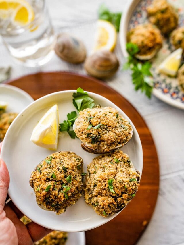 Best Italian Baked Stuffed Clams on a small plate ready to eat as an appetizer.
