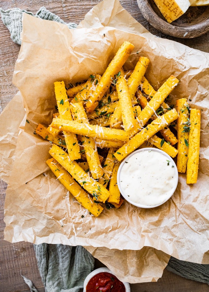 Crispy polenta fries with herbs and dipping aioli sauce.