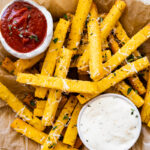 Crispy polenta fries with herbs and dipping aioli sauce. Side of ketchup.