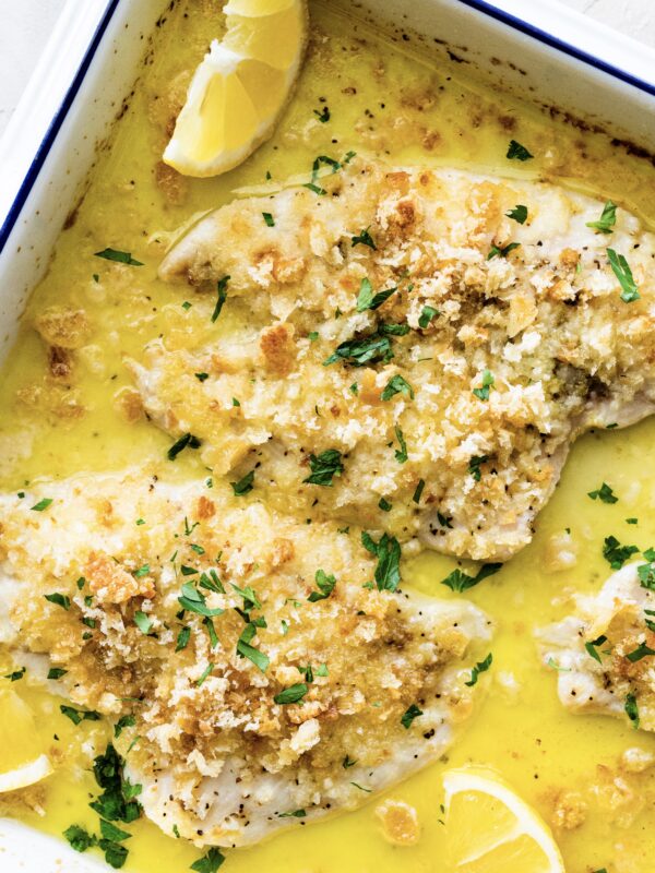 Baked Flounder Recipe with Lemon- fish with sauce after it is baked. Serve with lemon wedges.