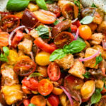 close up of the beautiful summer panzanella salad and all the colors and fresh tomatoes and soaked bread.