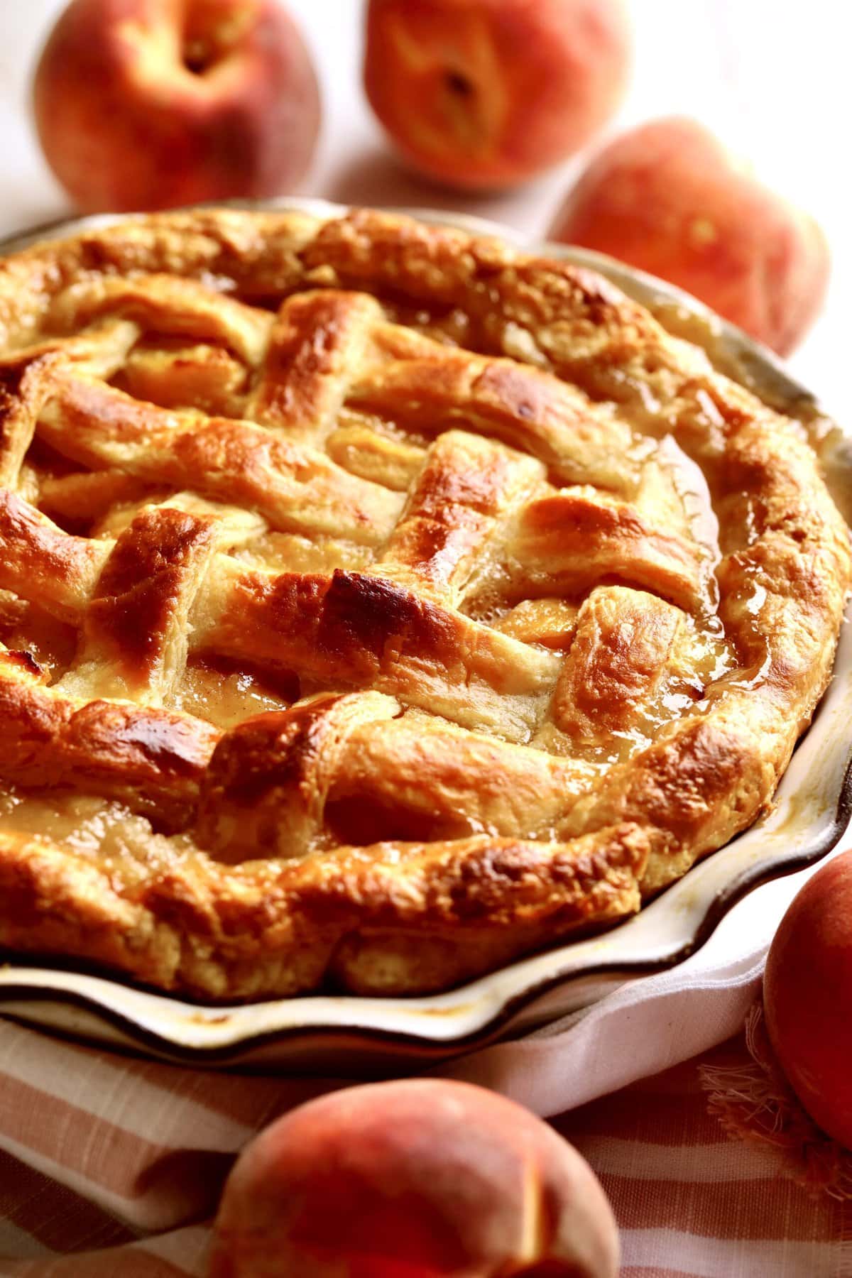 Lattice top on a fresh peach pie.