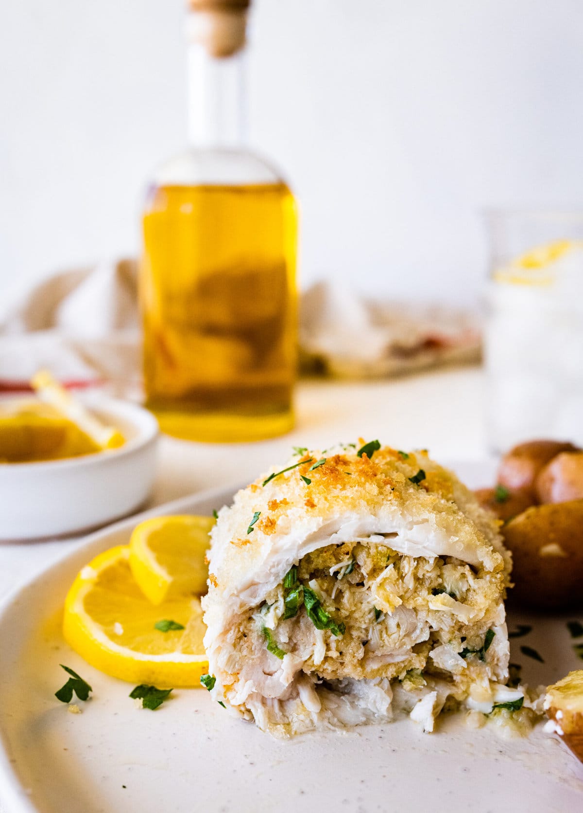 sliced baked flounder showing the stuffing. 