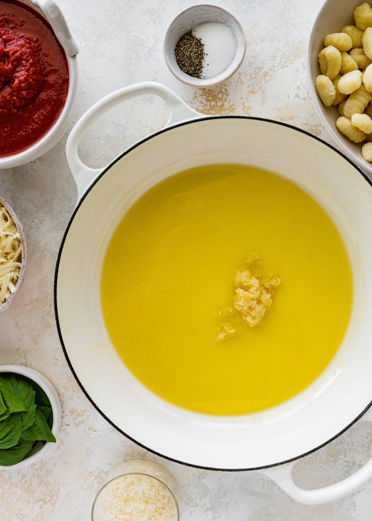 How to make gnocchi all sorrentina step-by-step- garlic in oil cooking.