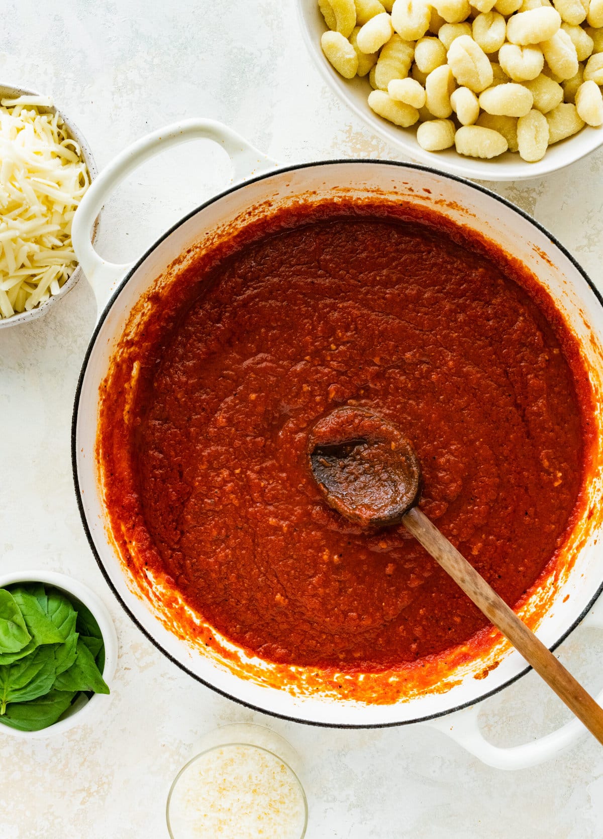 How to make gnocchi all sorrentina step-by-step- adding tomato sauce and cooking.