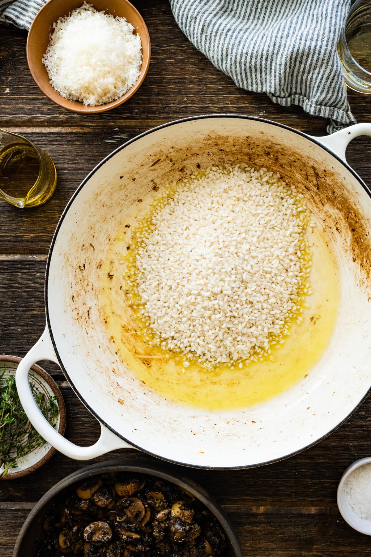 How to Make Creamy Mushroom Risotto Instructions- add the rice to the pan with the olive oil.