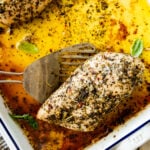close up of baked chicken on a spatula.
