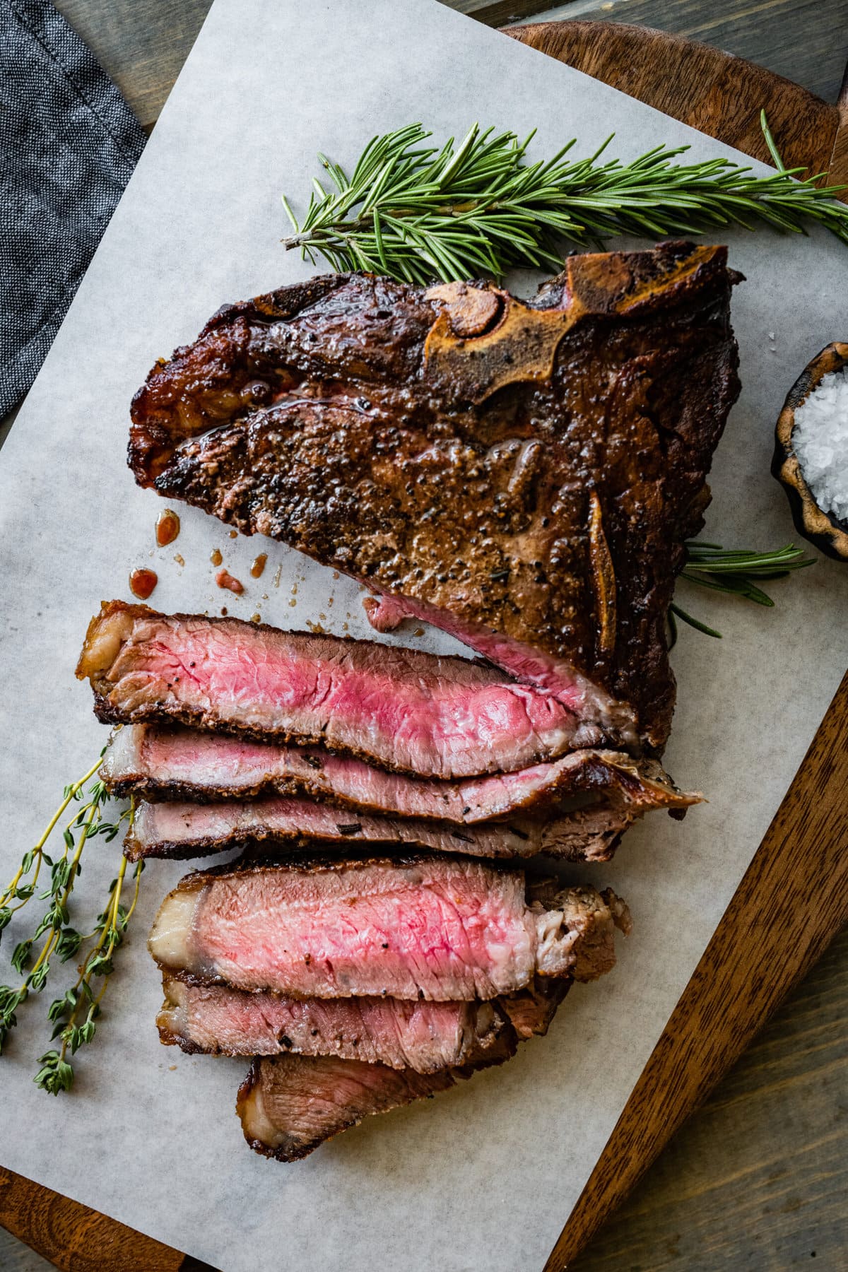 T-Bone Steak on a cutting board sliced and ready to plate.