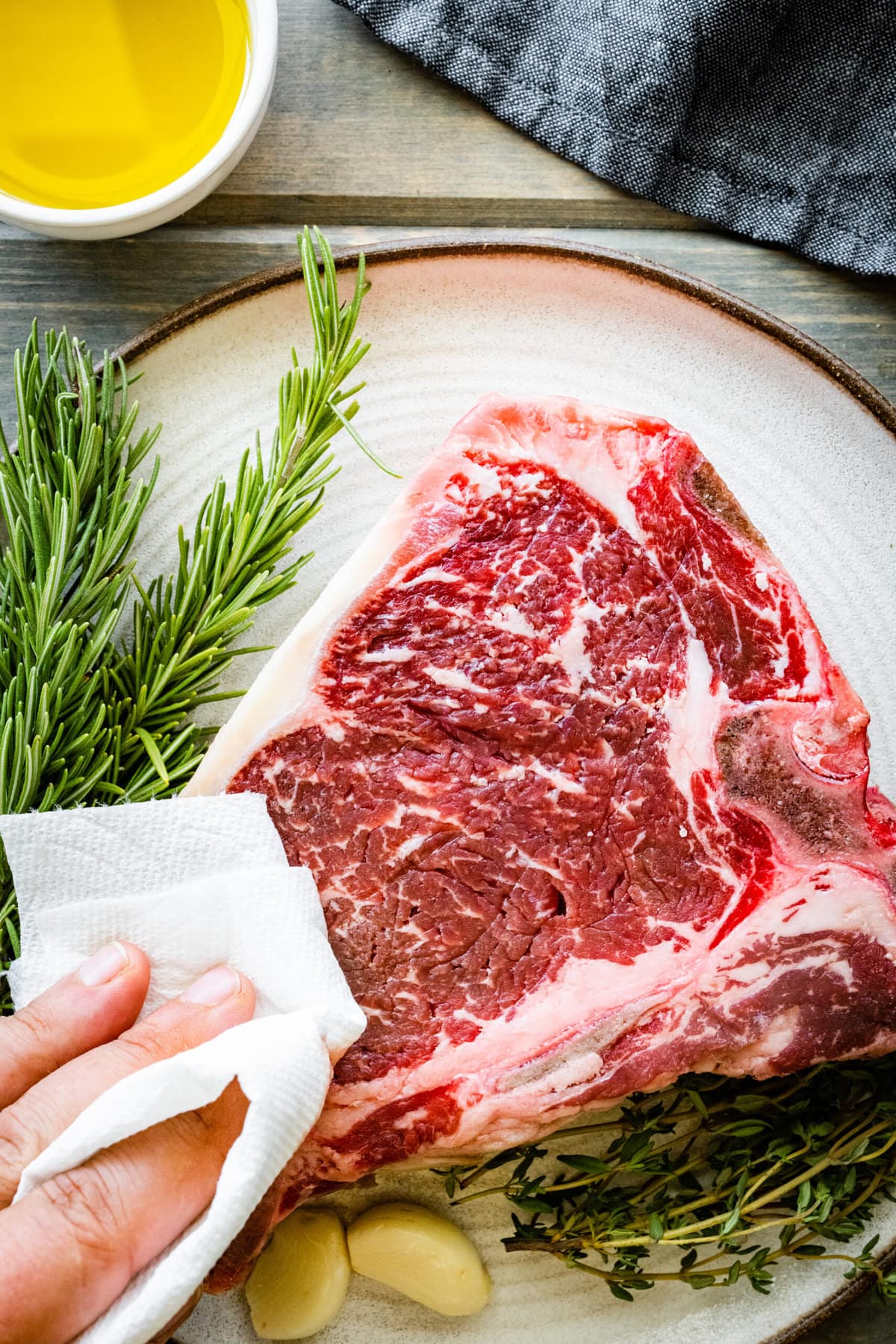 How to Cook T-Bone Steak in Pan Instructions- pat the steak dry with a paper towel.