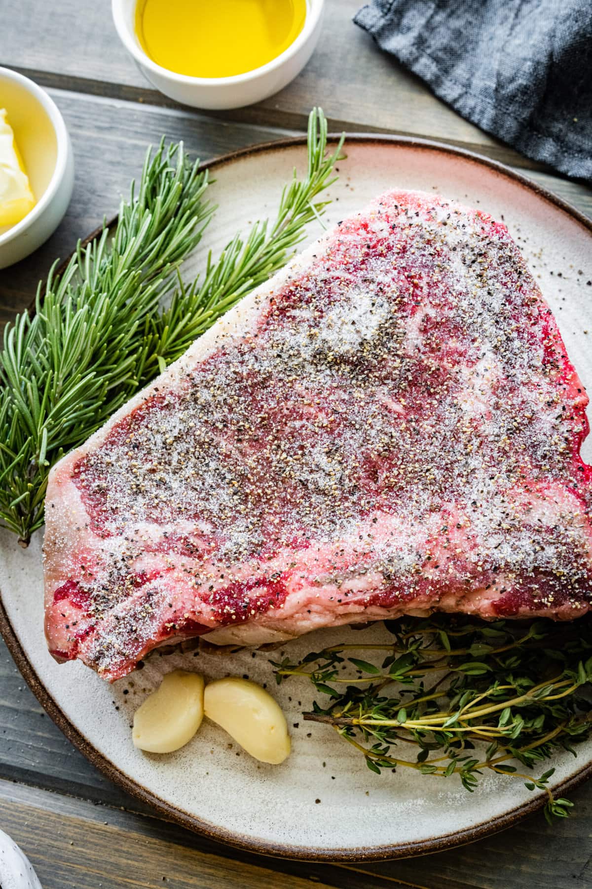 How to Cook T-Bone Steak in Pan Instructions- salt and pepper both sides of the steak.