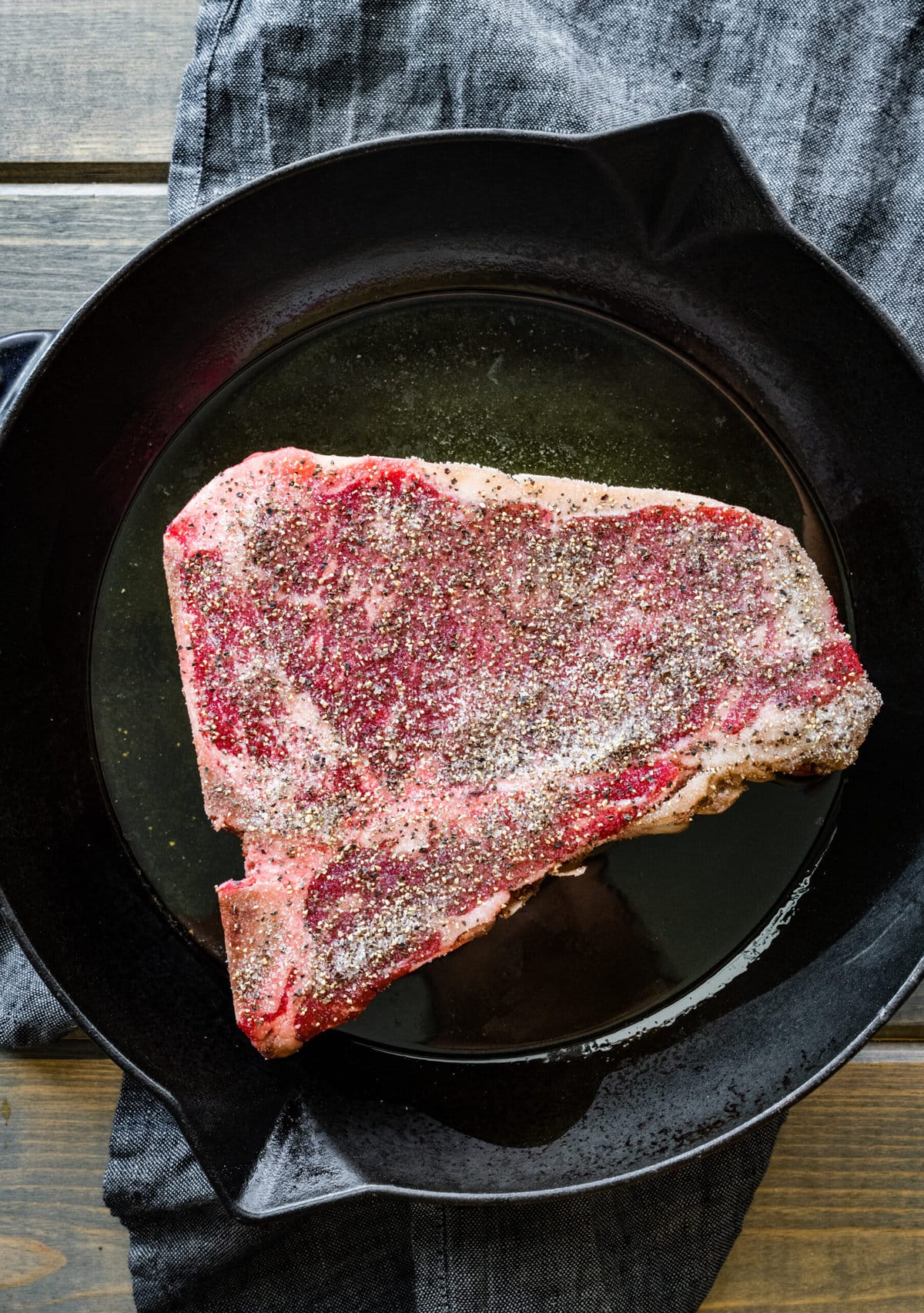 How to Cook T-Bone Steak in Pan Instructions- place steak in hot pan.