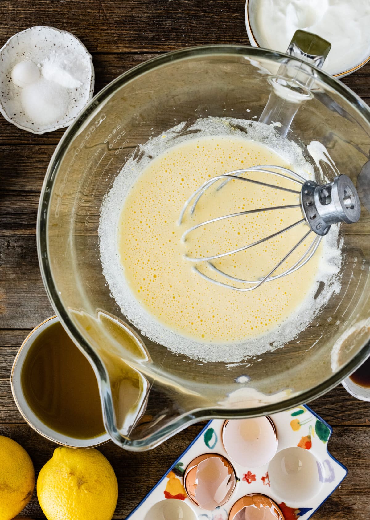 How to make olive oil cake (step-by-step) instructions- mixing eggs and sugar with whisk.