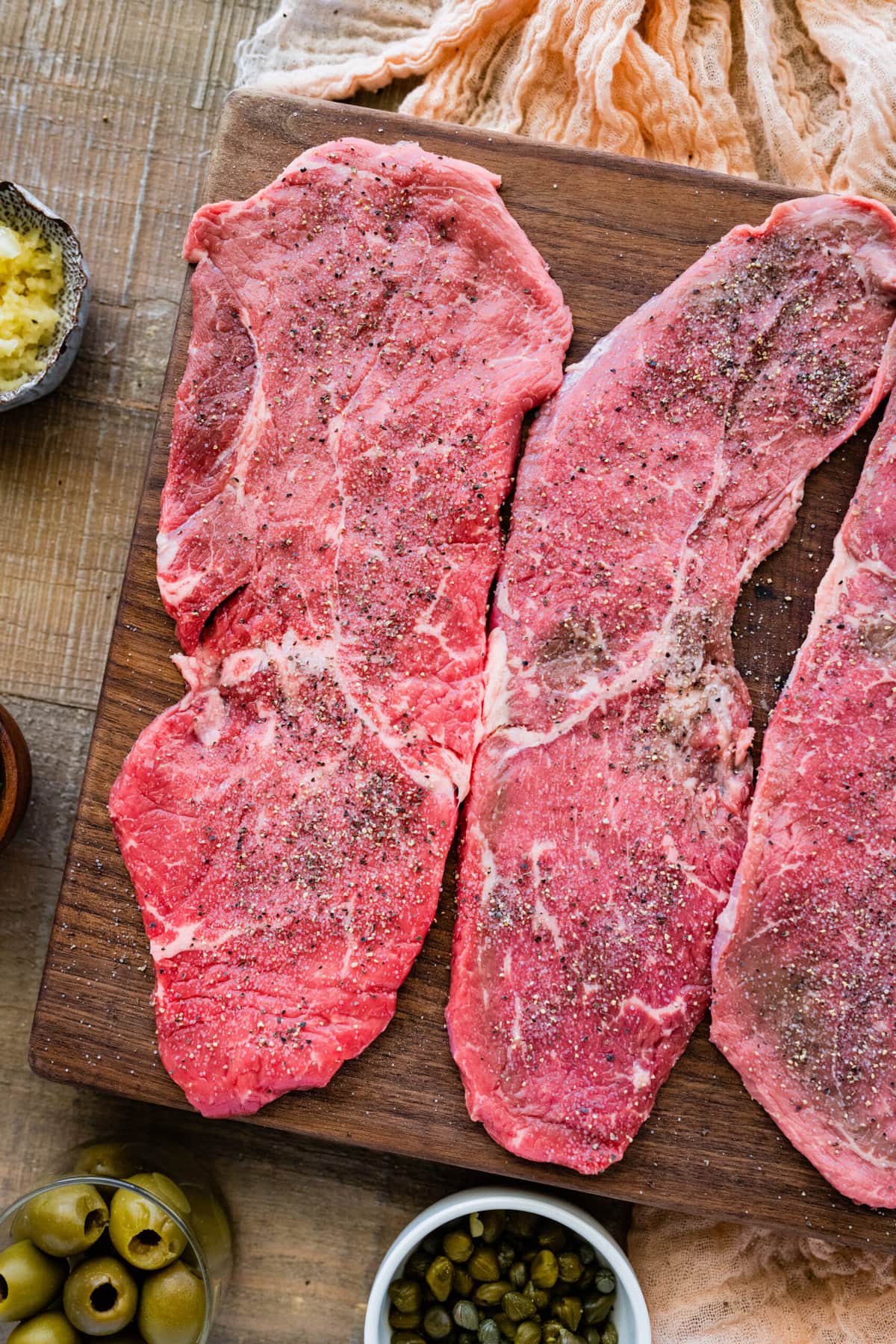 How to make steak pizzaiola step by step- seasoning steak.