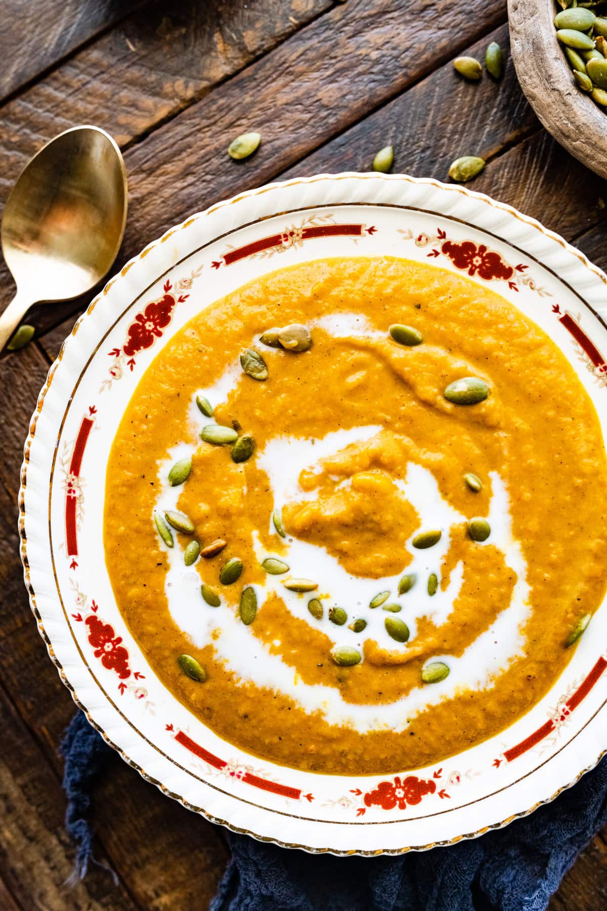 Autumn Squash Soup Recipe (Panera Copycat) in a beautiful bowl with spoon ready to eat.