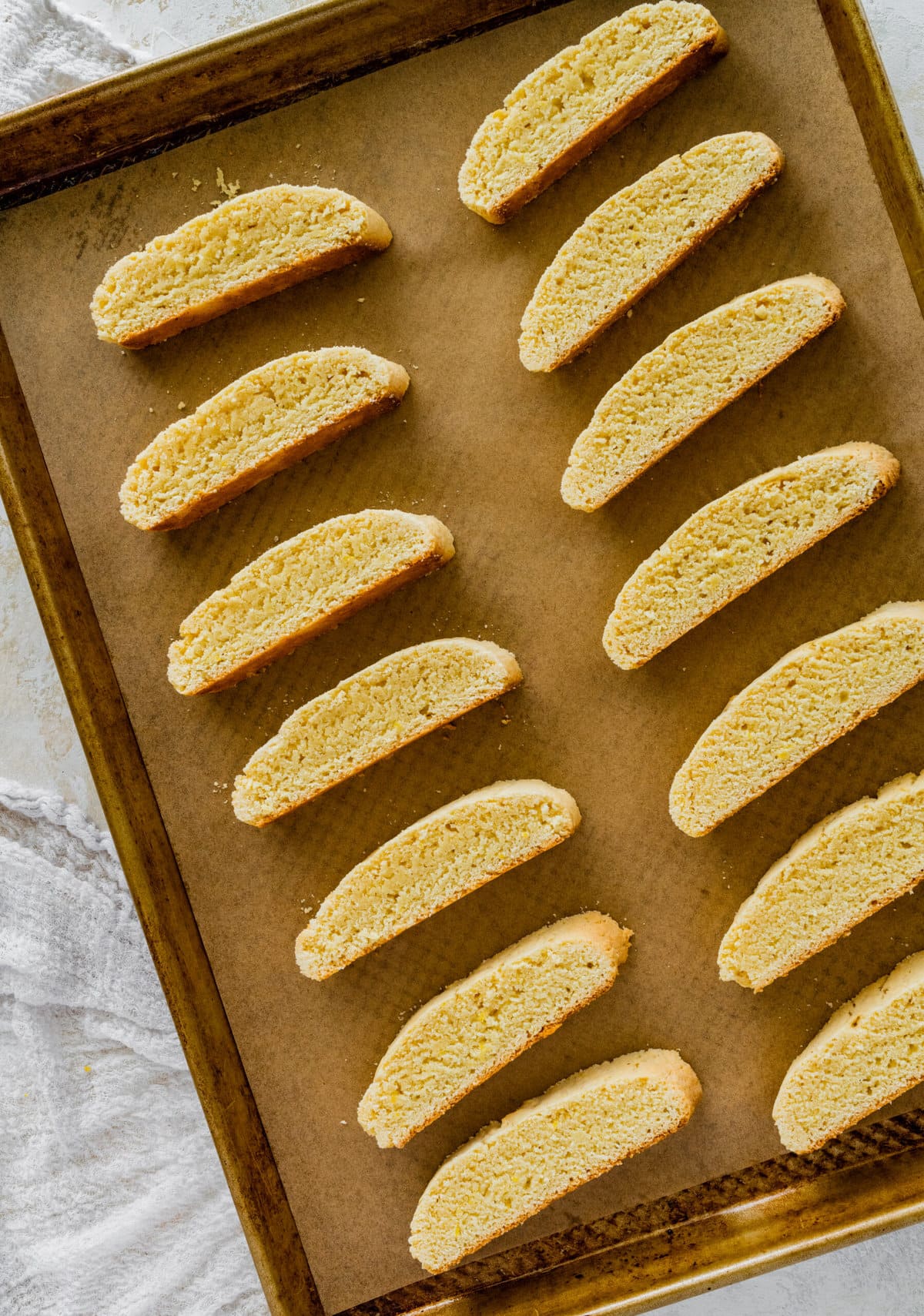 How to make Best Lemon Biscotti Recipe Step-by-Step: setting on baking sheet and cooking biscotti for the second time.