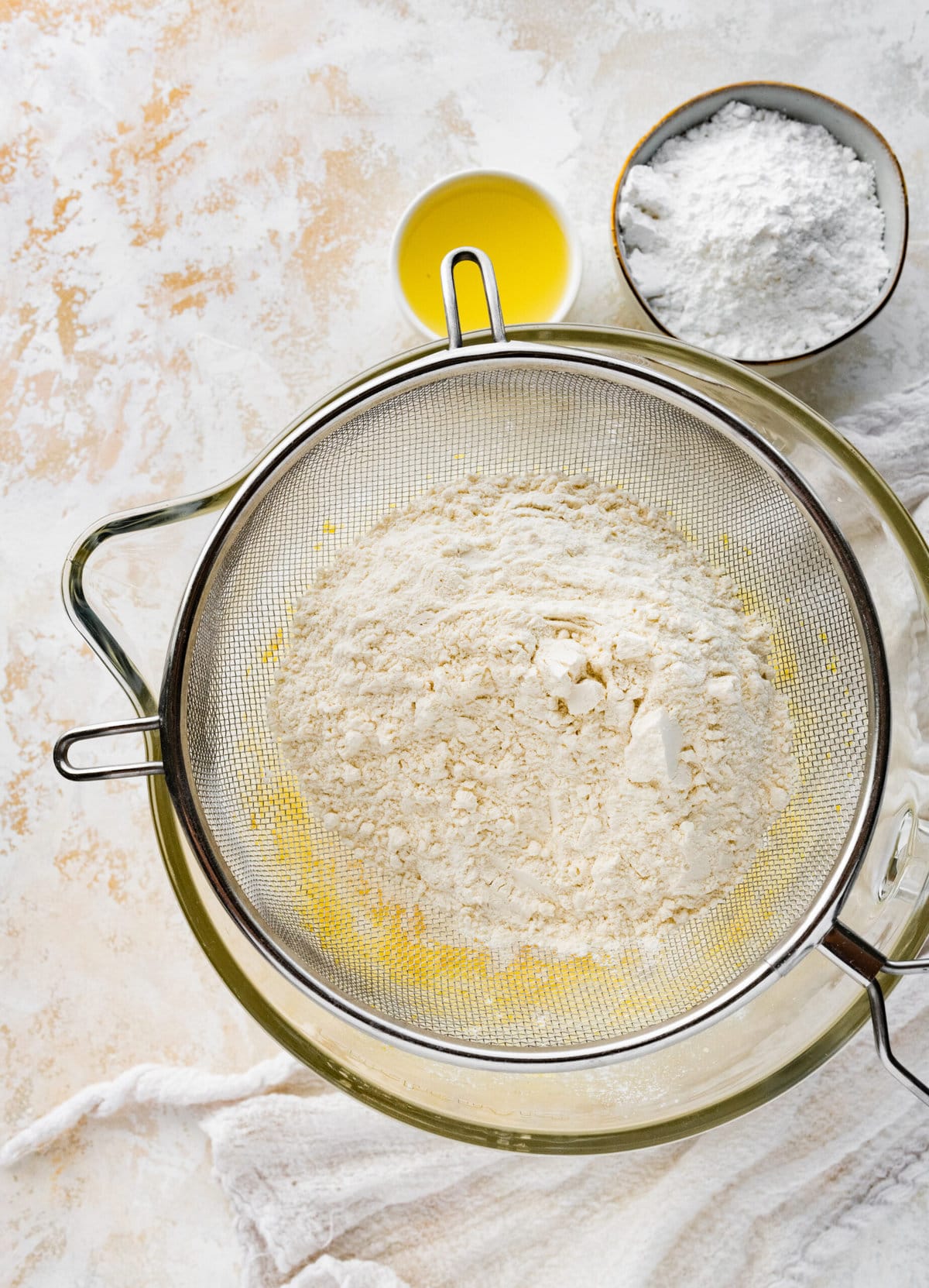 How to make Best Lemon Biscotti Recipe Step-by-Step: sifting in the dry ingredients over the wet.