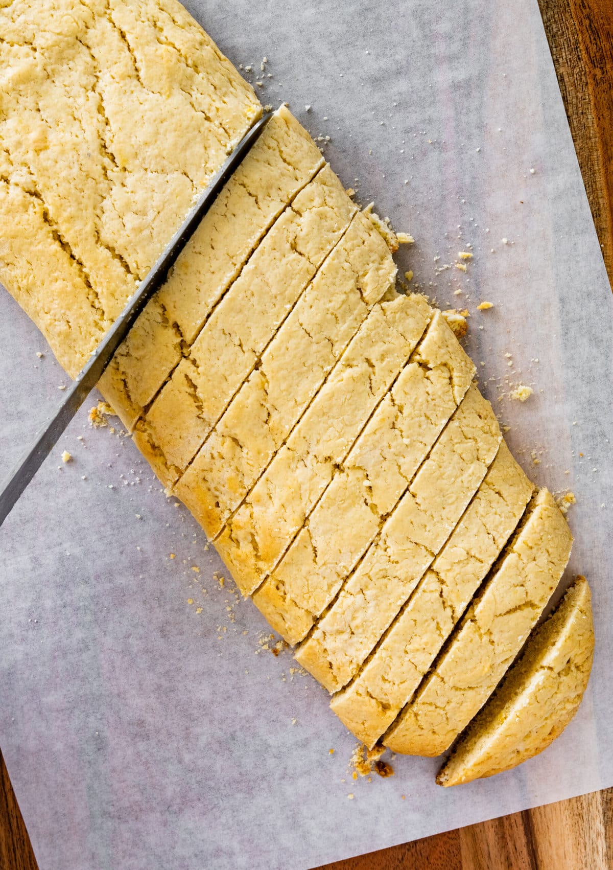 How to make Best Lemon Biscotti Recipe Step-by-Step: slicing the cookie logs into thin cookies.