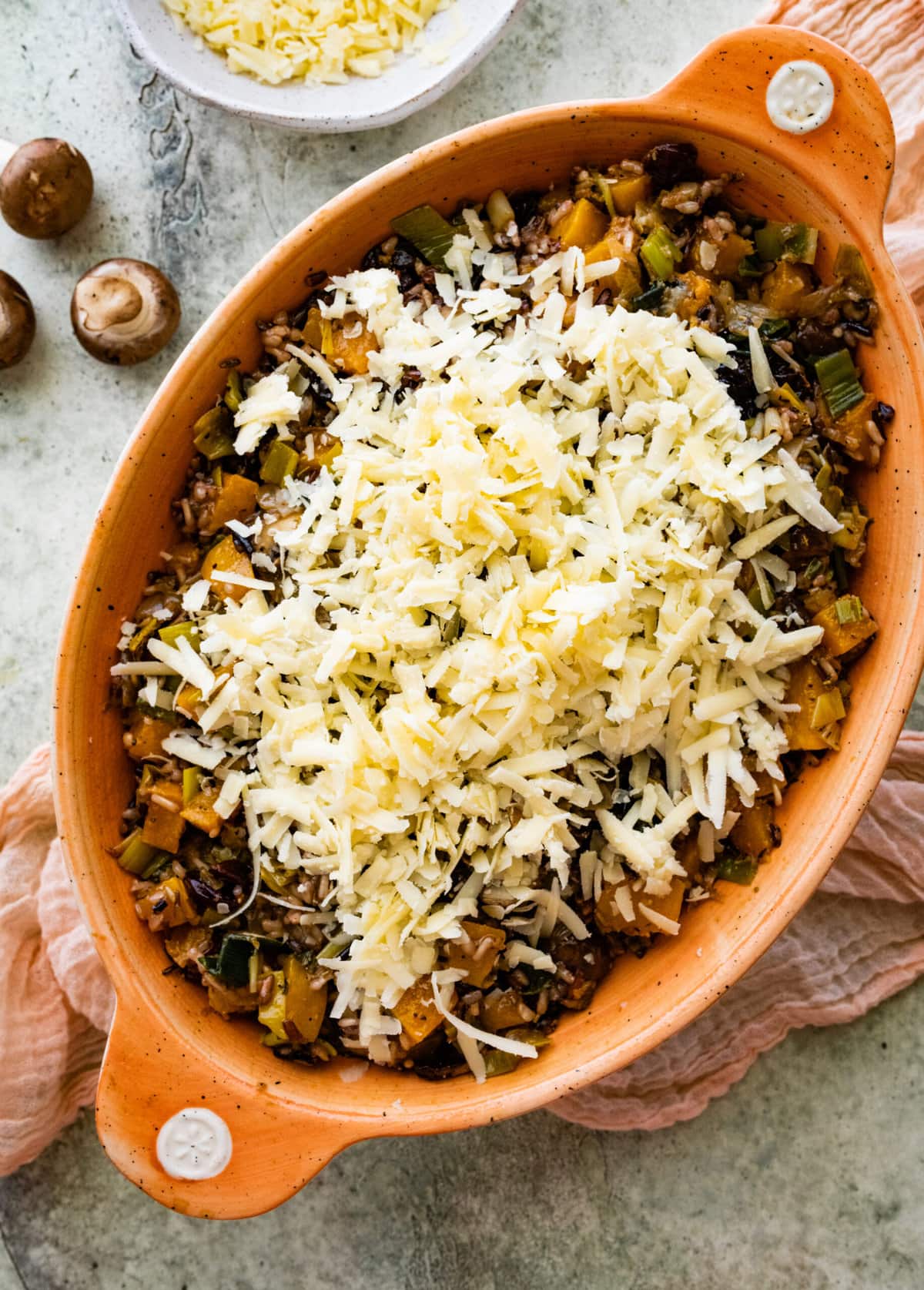 How to make Butternut Squash Casserole Recipe Vegetarian Step-by- Step: adding cheese to the casserole dish and baking.