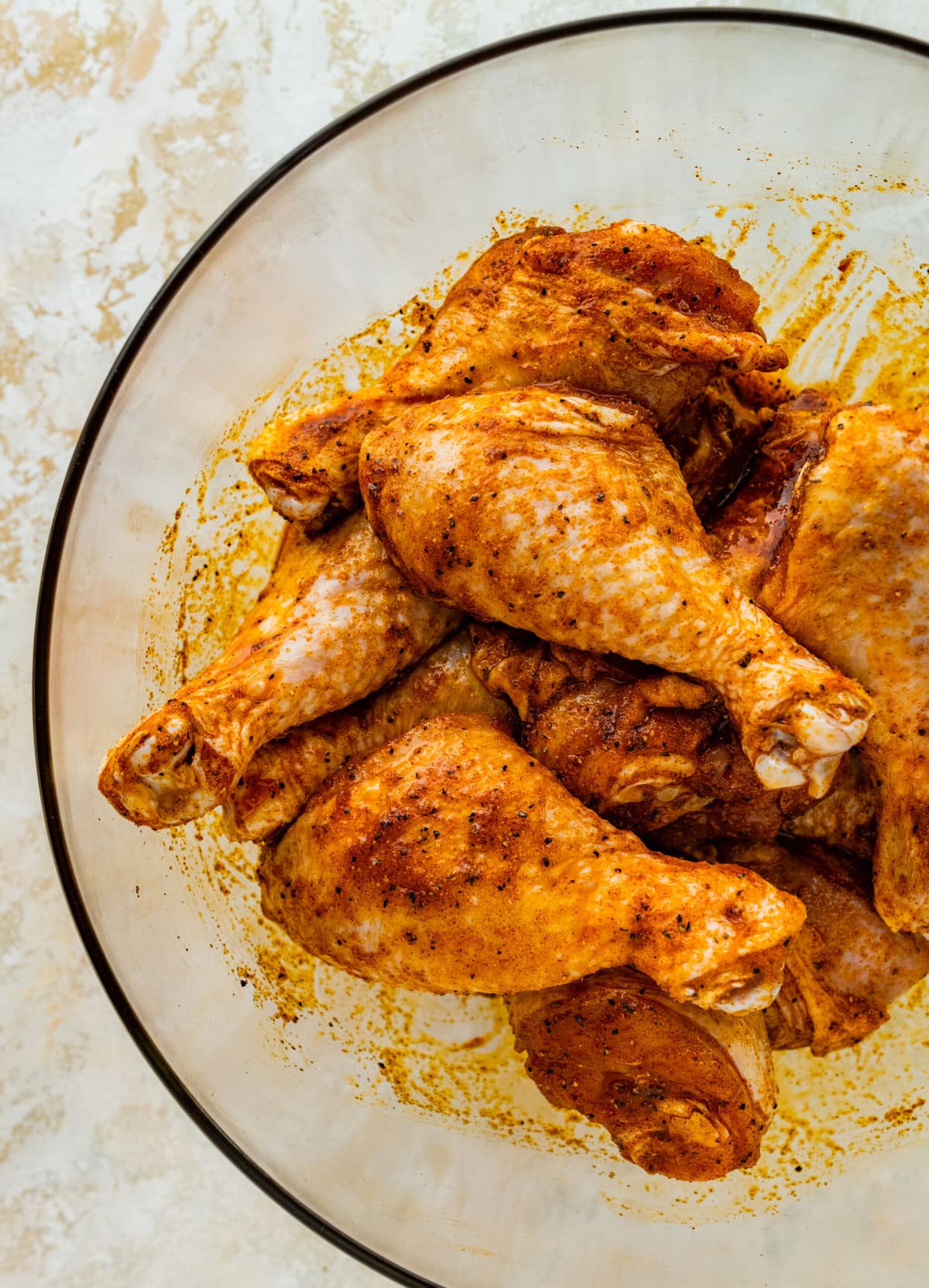 How Long to Bake Chicken Drumsticks at 400- adding the marinade to the drumsticks.