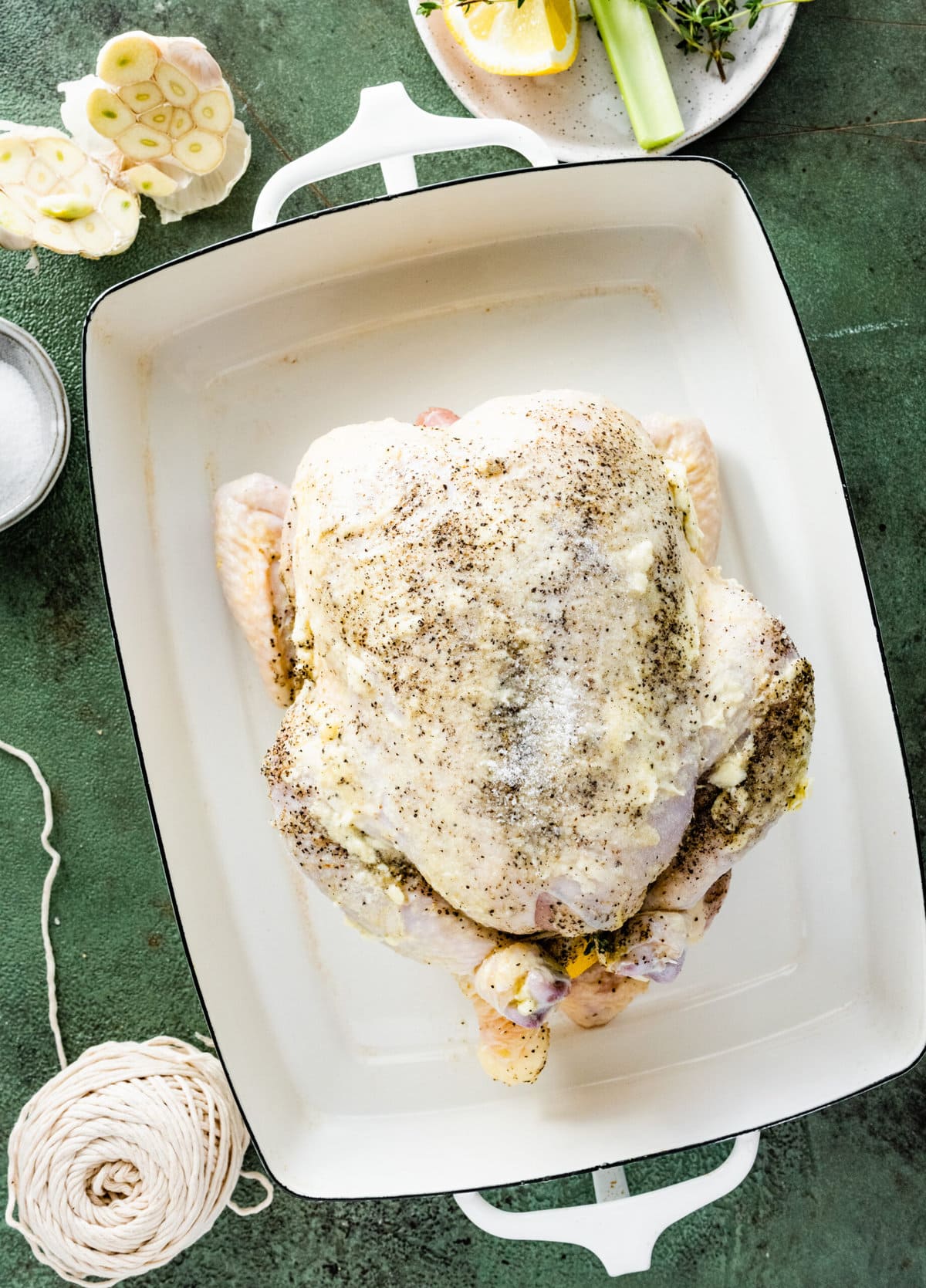How Long to Cook Whole Chicken Recipe Perfect & Juicy (step-by-step instructions)- placing the chicken in baking dish ready to bake.