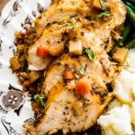 close up of sliced chicken breasts on plate. Nice and juicy chicken.
