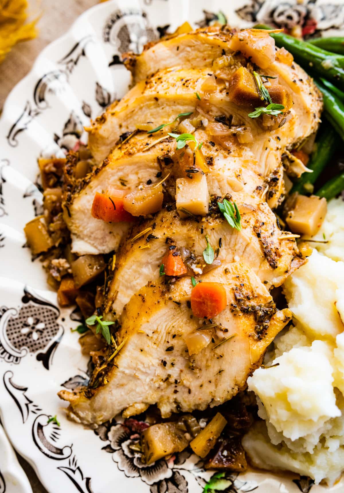 close up of sliced chicken breasts on plate. Nice and juicy chicken.