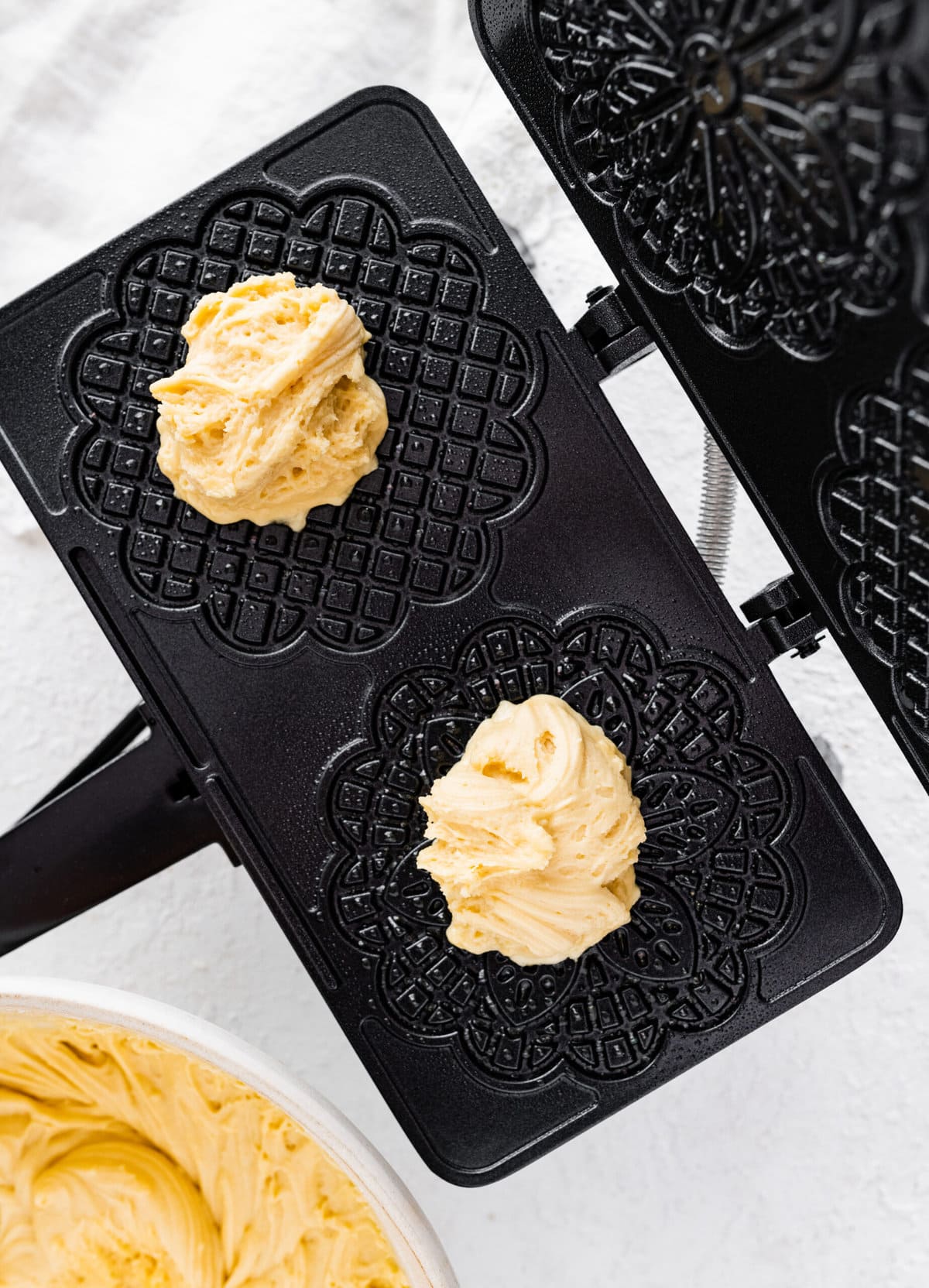 How to make best pizzelle cookie recipe step-by-step: batter on the hot griddle. ready to close and cook.