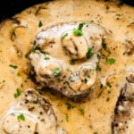 Skillet of steak marsala with mushrooms.