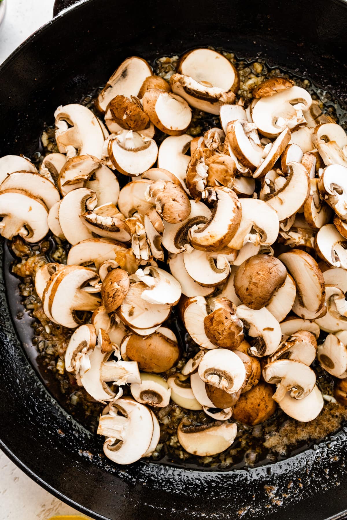 How to make best Steak Marsala recipe step-by-step: making mushroom sauce in pan.