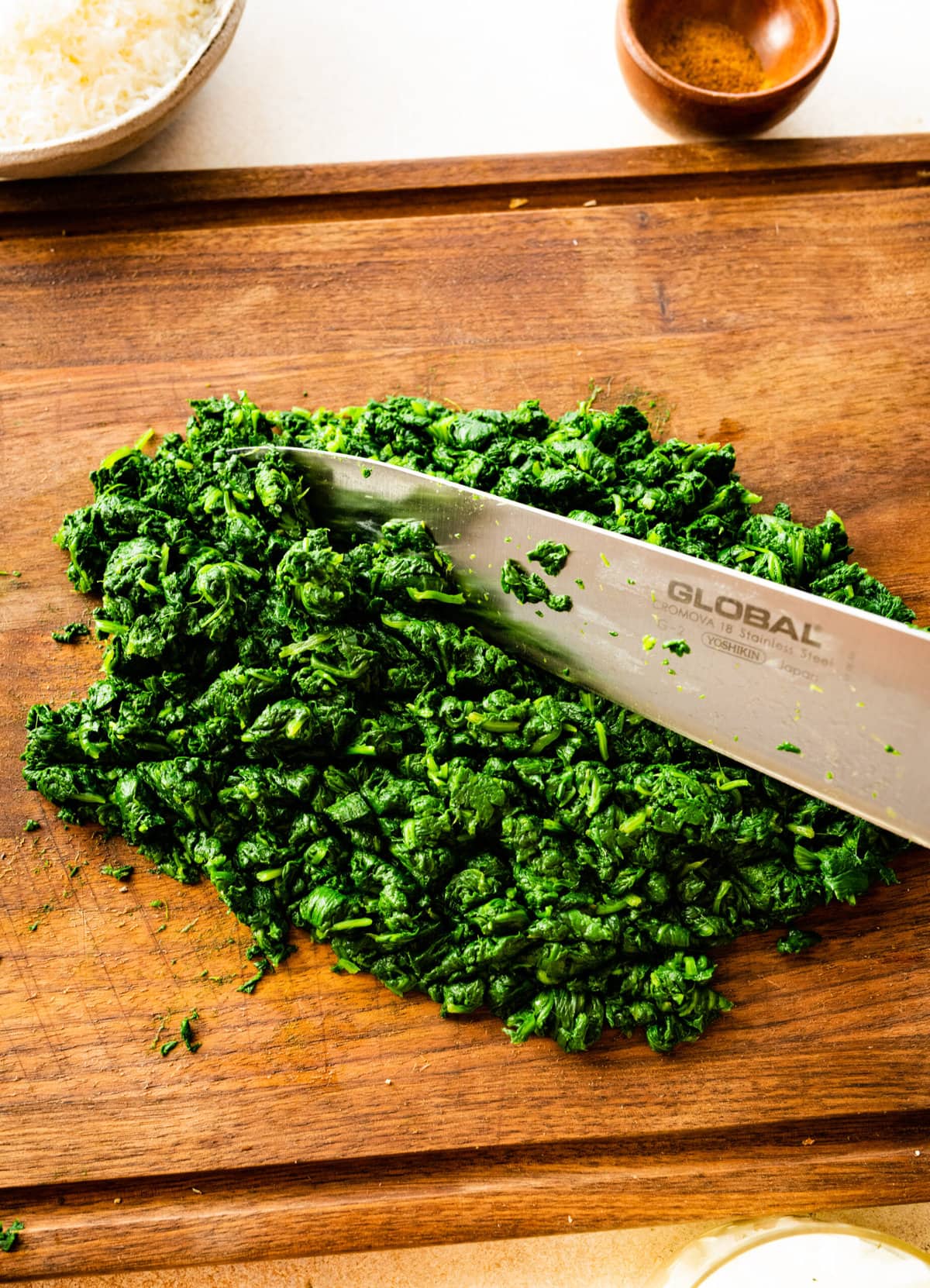 How to make Best Steakhouse Creamed Spinach Recipe- chopping spinach with sharp knife.