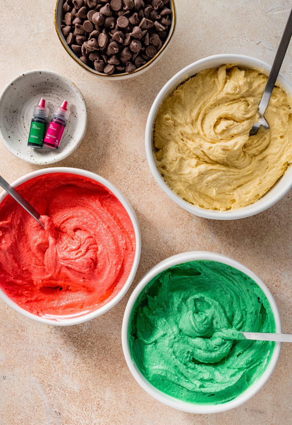 How to make Calssic Italian Rainbow Cookies Step-by-Step Instructions: coloring each bowl of cake batter with red, white, and green.