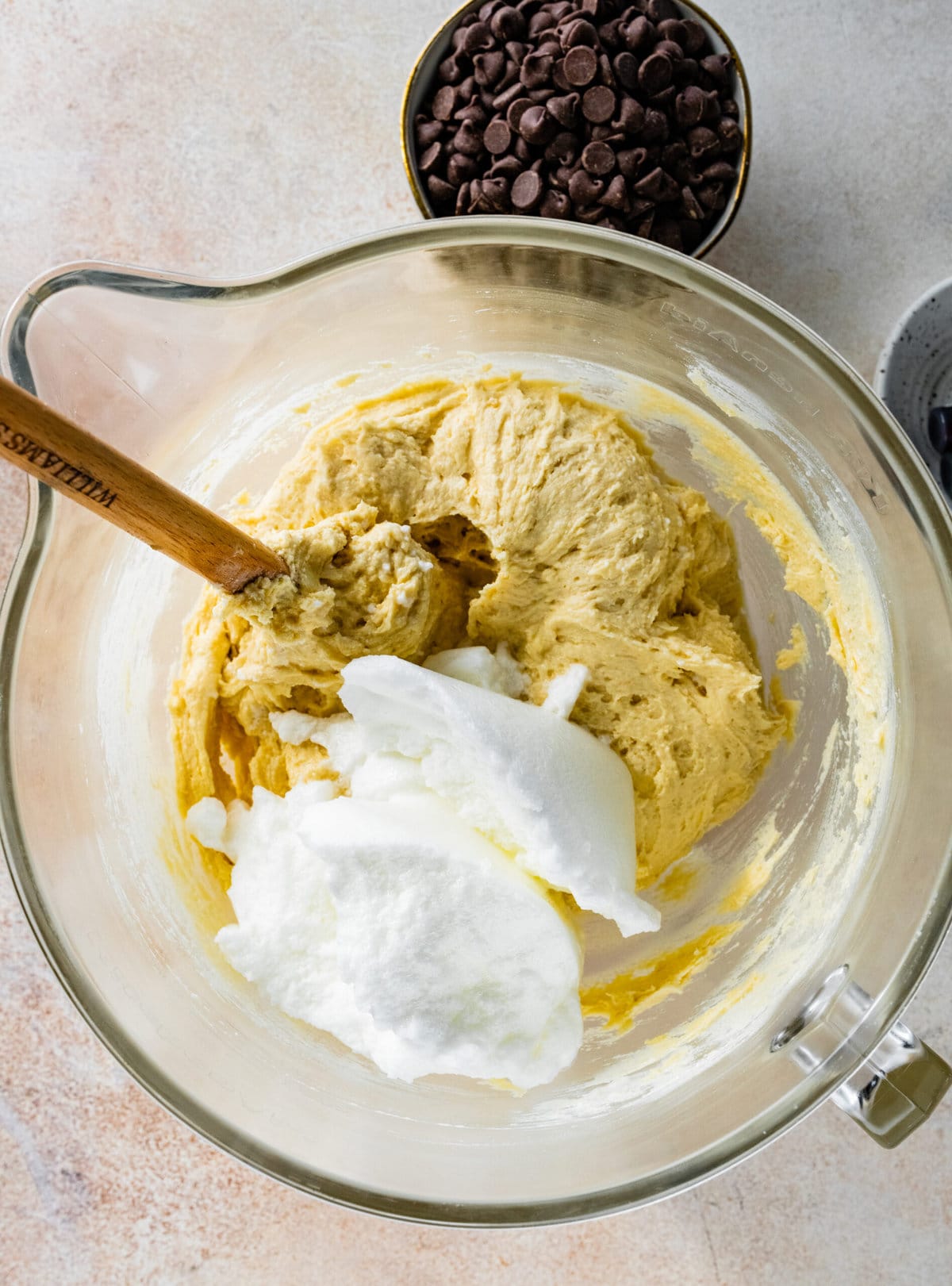 How to make Calssic Italian Rainbow Cookies Step-by-Step Instructions: adding whipped egg whites to the batter mixture.