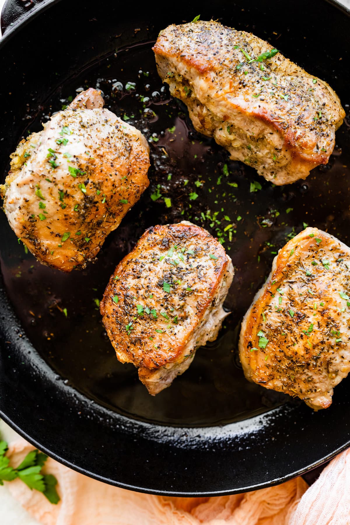 how to make Oven Baked Stuffed Pork Chops Recipe: pork chops cooking on the pan.