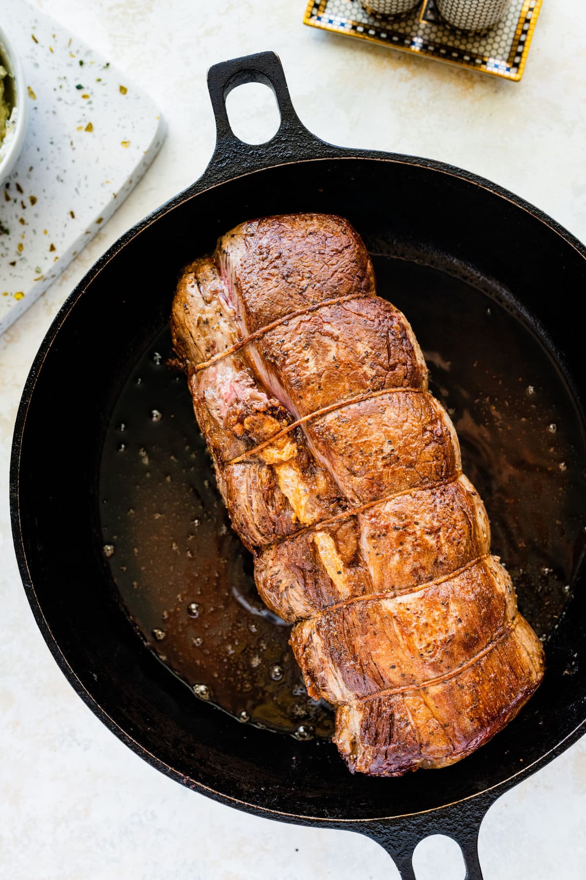 How to make perfect roast beef tenderloin- searing the beef tenderloin in a pan.