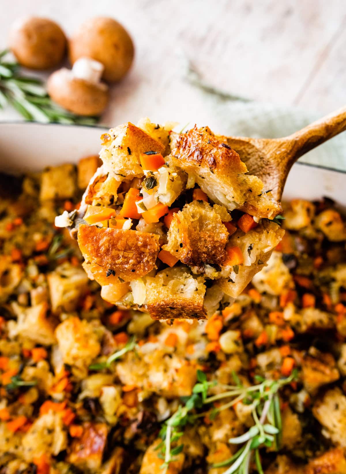 close up of stuffing on a wooden spoon ready to serve.
