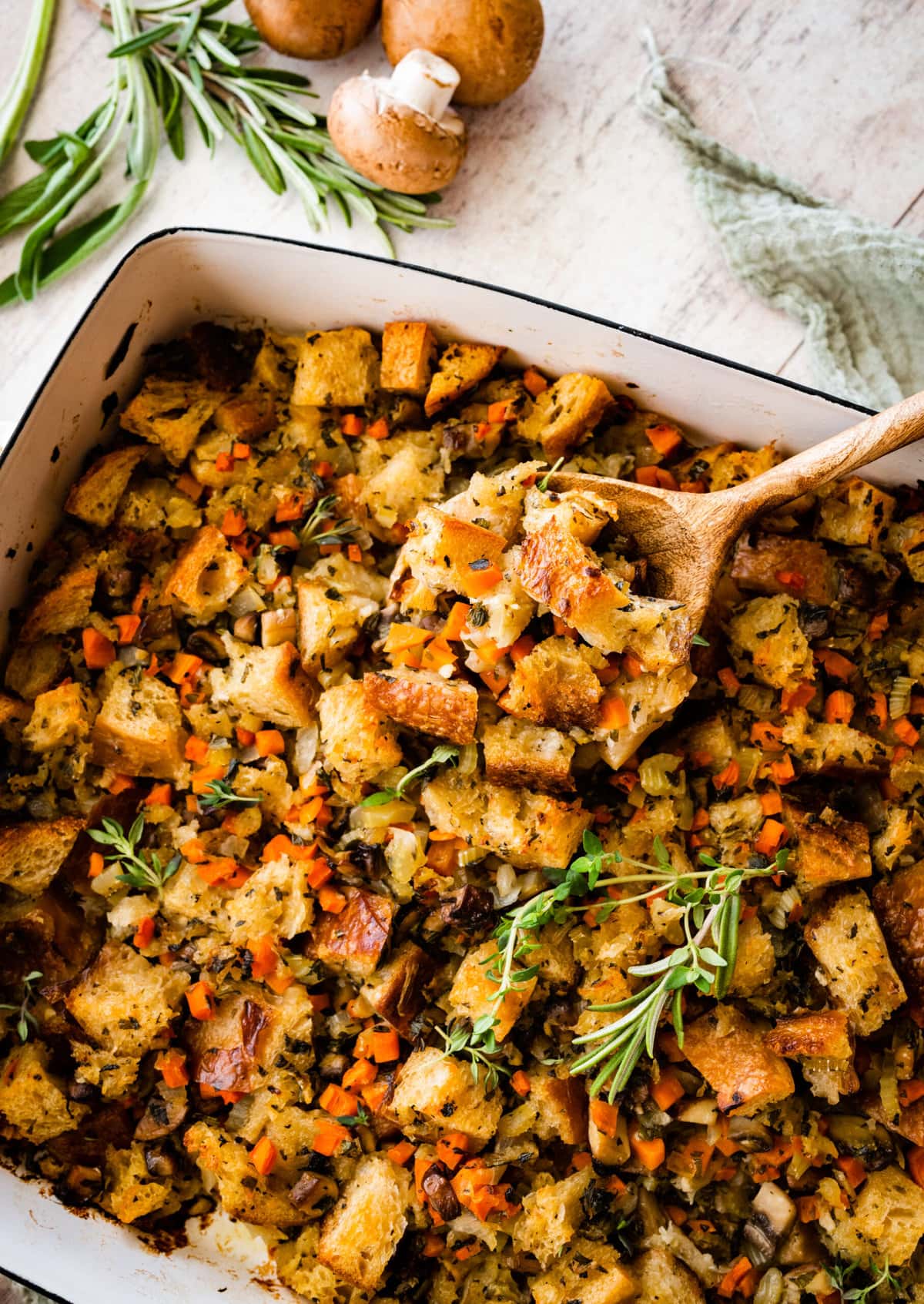 close up of stuffing on a wooden spoon ready to serve. 
