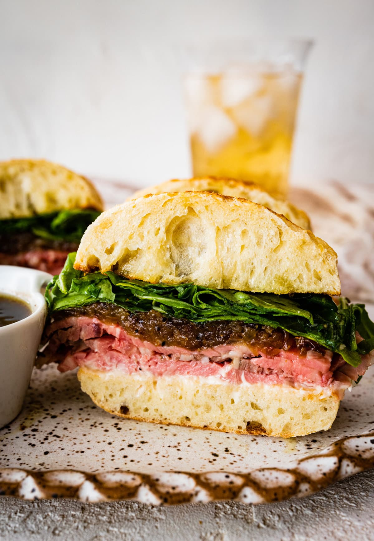 sandwich cut in half with all the layers of ingredients.