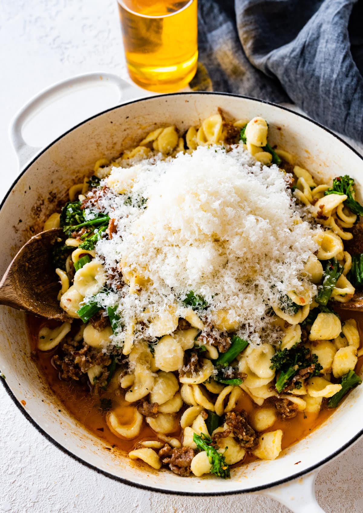 how to make Easy Orecchiette with Sausage and Broccoli- step-by-step: add parmigiano cheese to the cooked broccoli to the sausage.