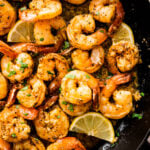 Shrimp with garlic butter in a skillet.