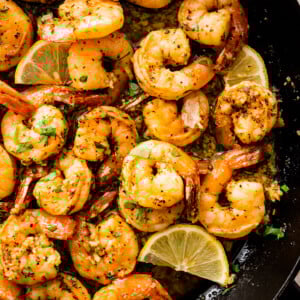 Shrimp with garlic butter in a skillet.