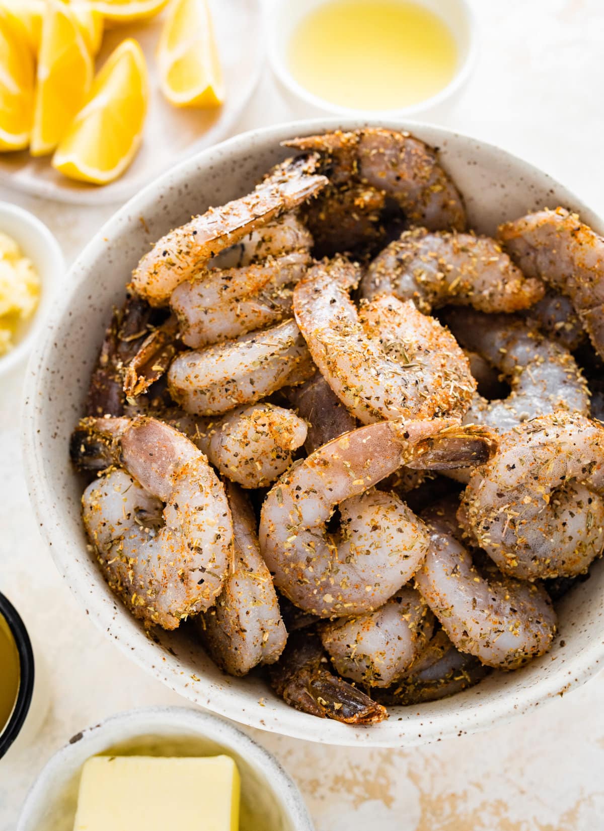 How to make easy pan seared shrimp step-by-step: mixing the shrimp and spice mix.